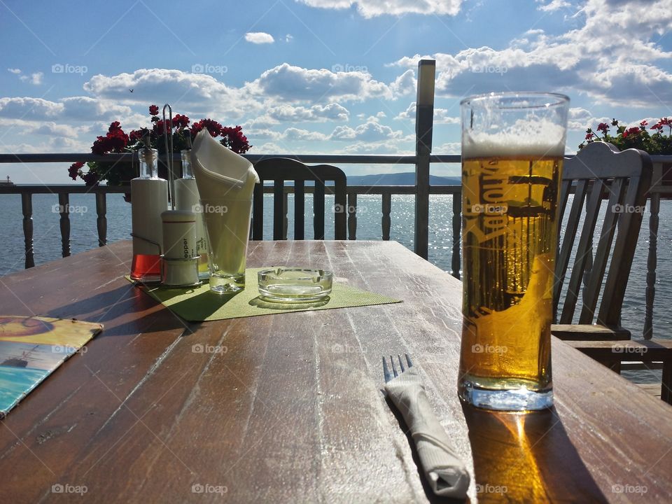 table with a glass of beer