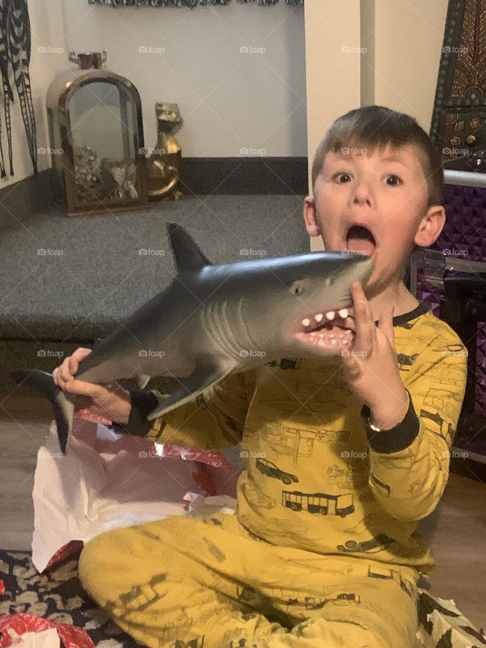 Boy showing fear by getting bitten by a shark! 