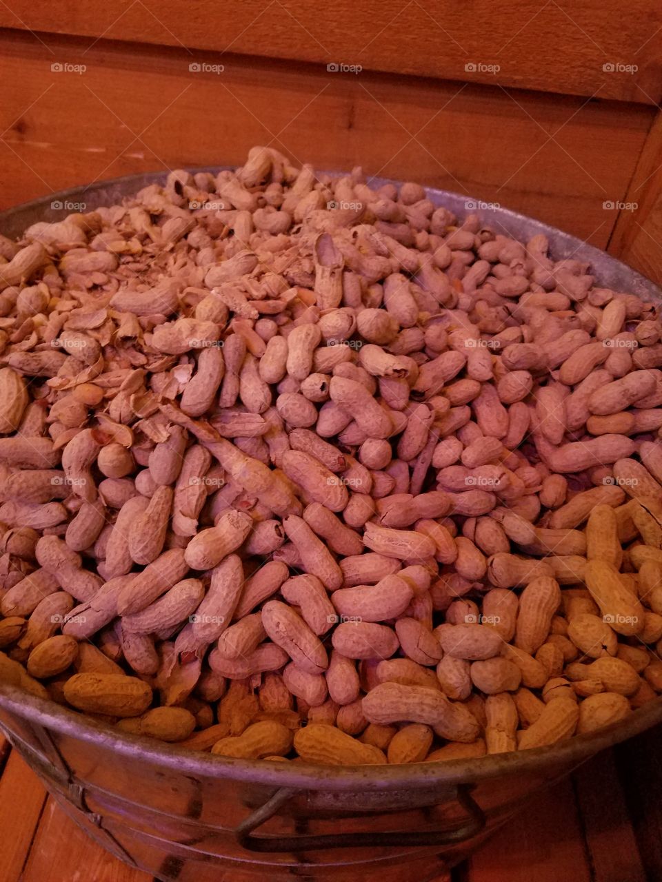 Close-up groundnuts in steel bucket
