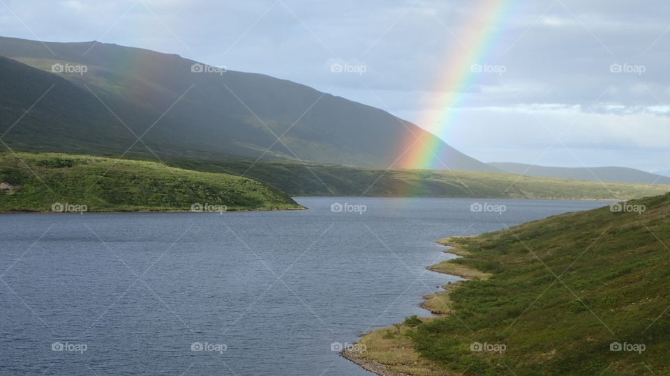 Rainbow over lake. 