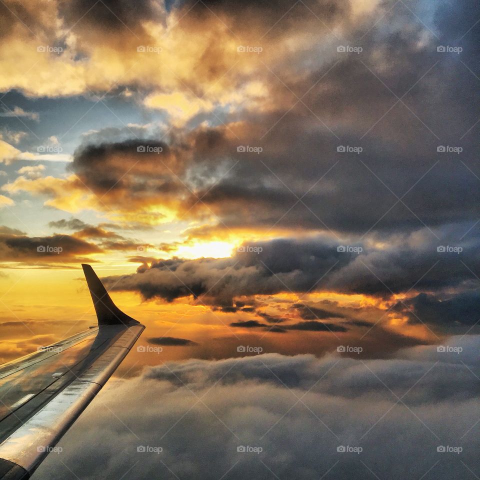 Airplane in the dramatic clouds