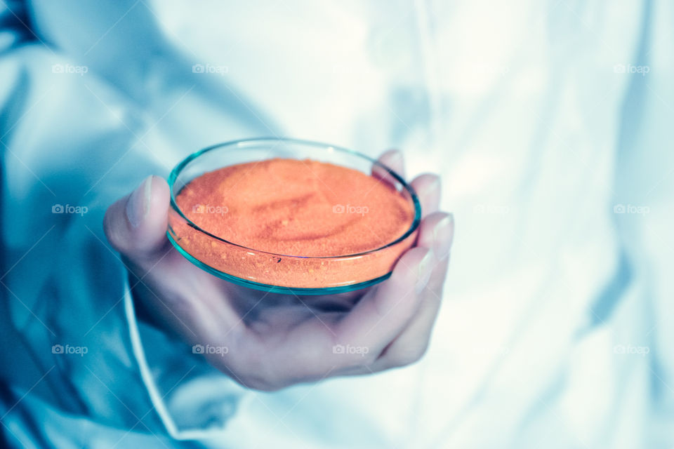 Woman using chemistry and science equipment