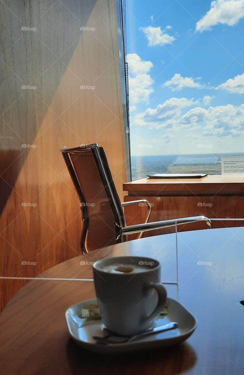 coffe in sunlit office with beautiful vue