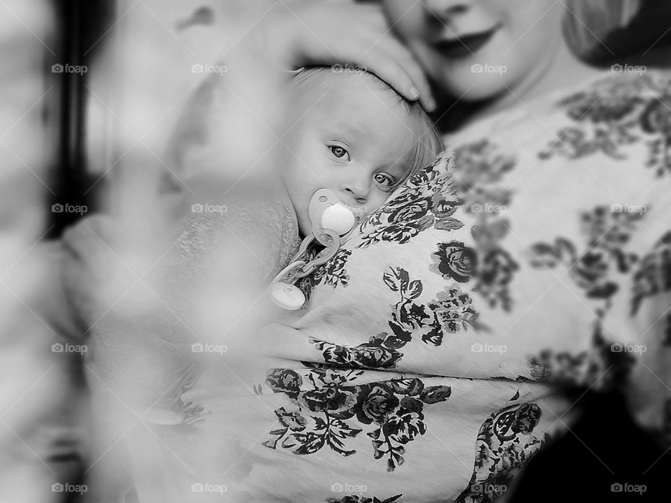 Baby sleeping on mothers chest.