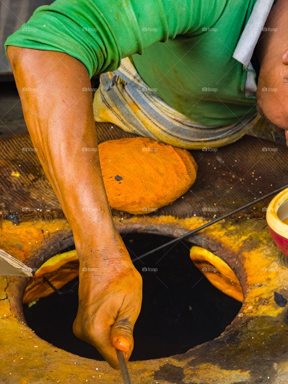 Baking of tandoori roti called sheermal in india made up of many ingredients