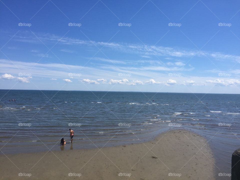 Ocean with kids in the bottom left corner