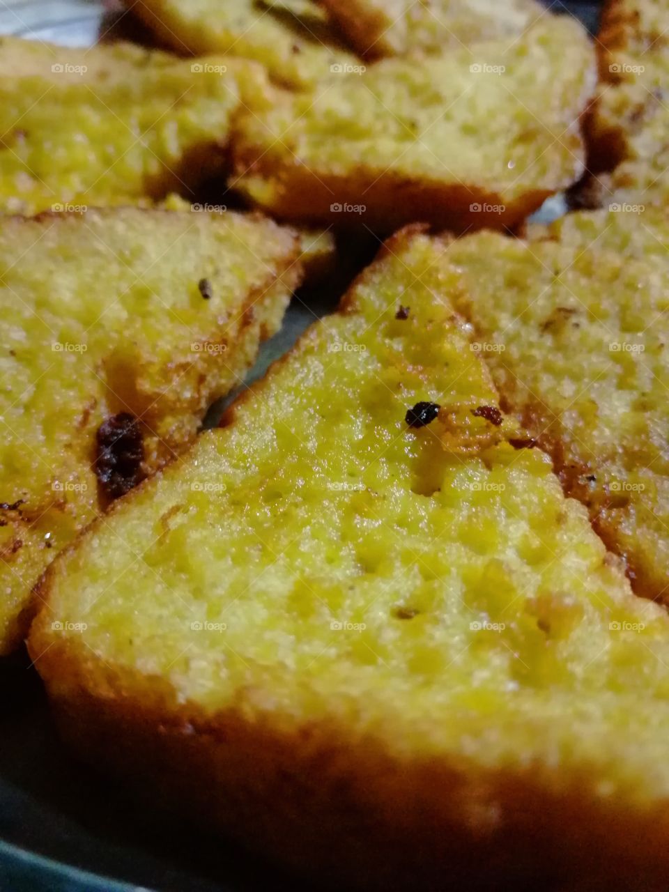 Bread Pakoda or Bread slice Mix with spice chilli salt and fried in oil,It is used as break fast and also sell in Indian Stall in market
