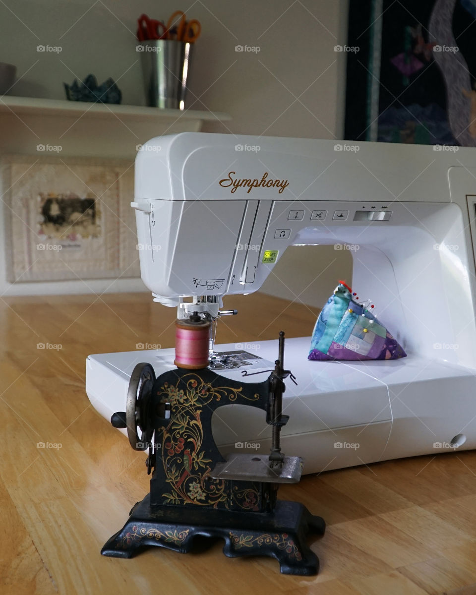 Antique Children’s Sewing Machine with contemporary Sewing Machine 