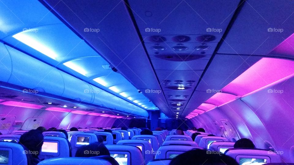 Blue and pink lights on a airplane