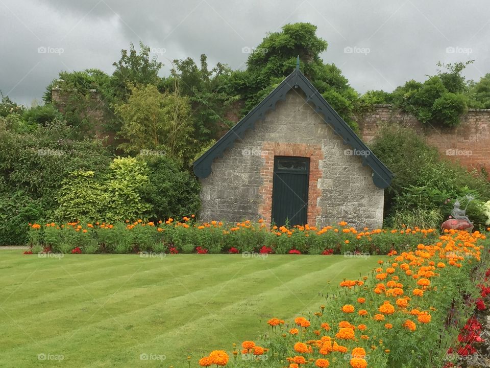 The charming gardens at Dromoland Castle, Ireland.   Don't you just want to peek inside?