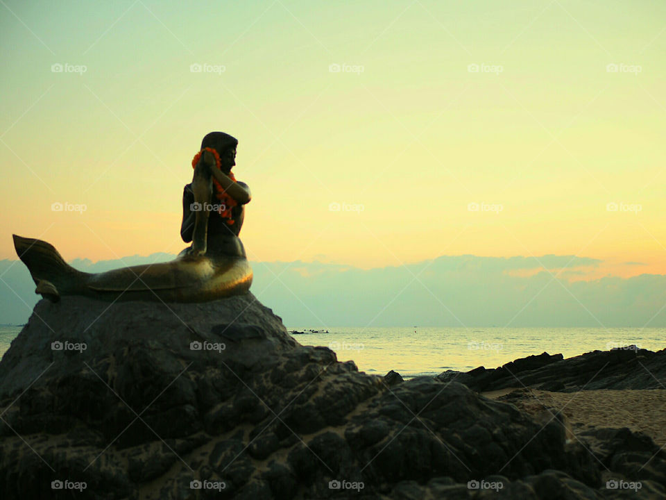 Mermaid statue at sunset , Samila beach Songkhla Thailand