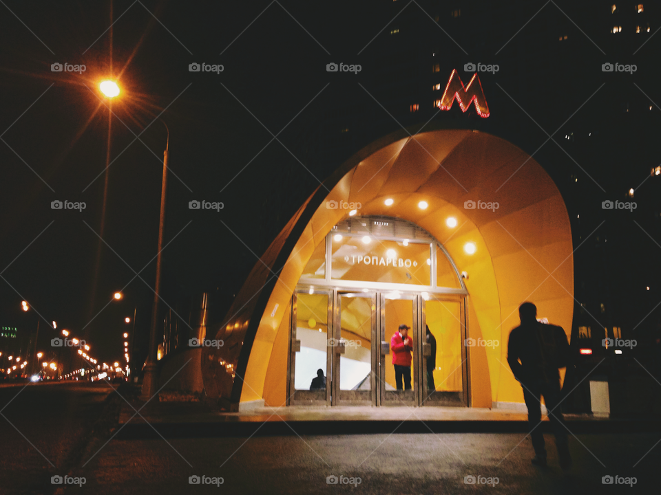 Brightly decorated entrance to one of the Moscow city metro underground stations at night
