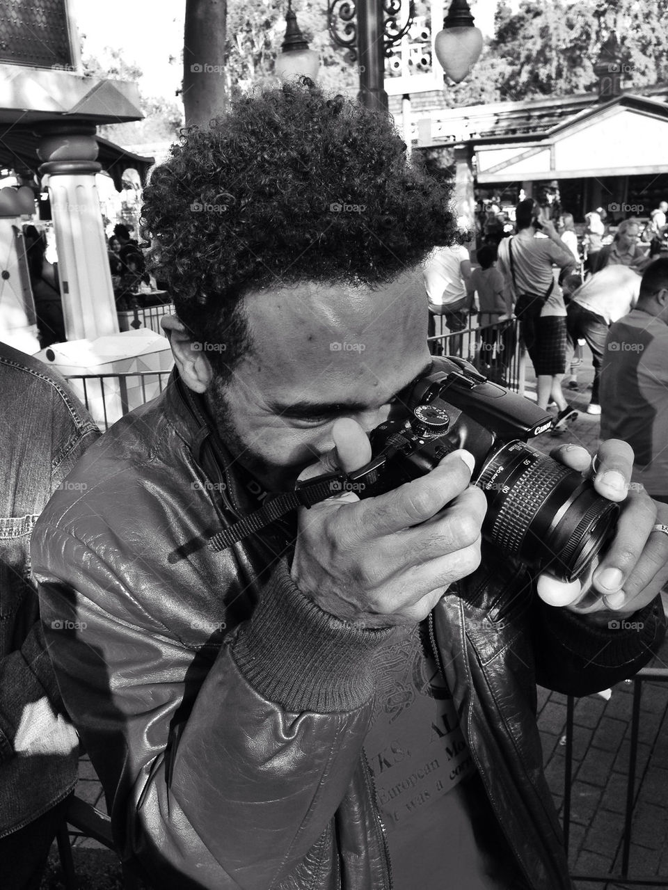 Amateur photographer snapping pictures in a public space