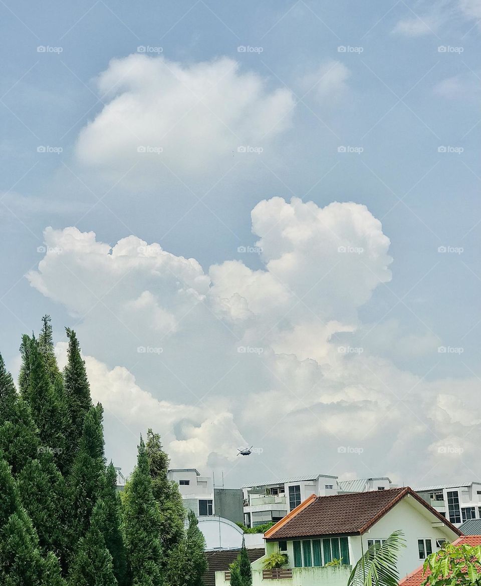 A beautiful silver cloud formed in the blue sky like a man face having two horns on his head , if you can observe deeply also find a man with face having close his eyes and relaxing peacefully 😍