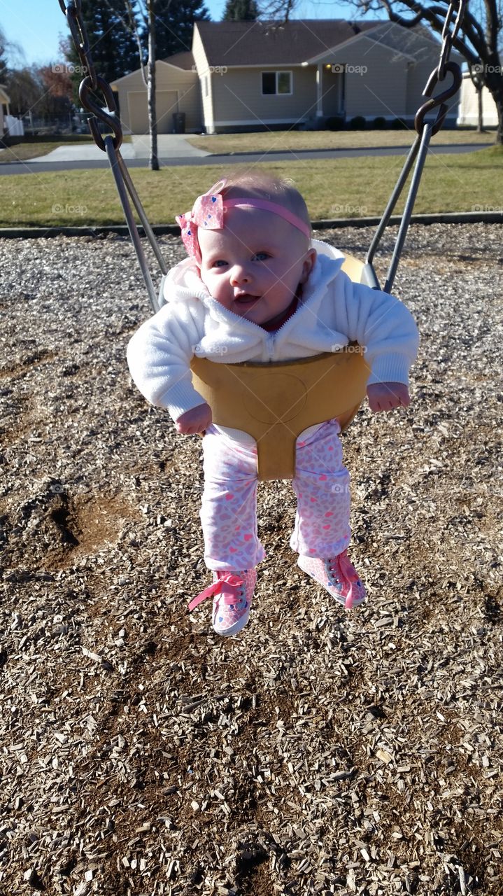 A day on the swings. My baby girl loving the swings at four months old.