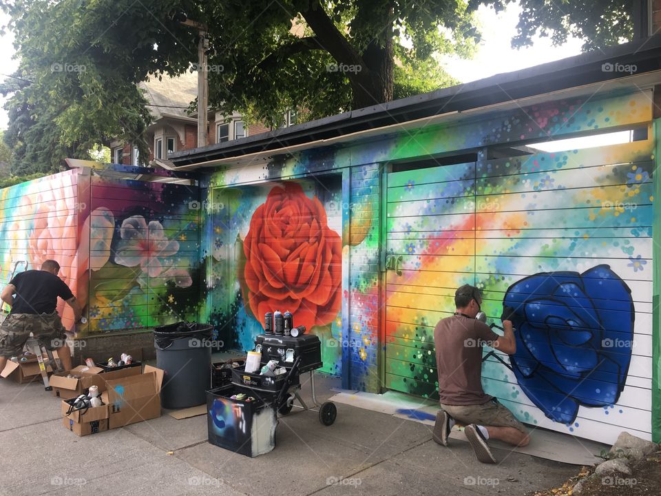 Artist creating Happy Graffiti 