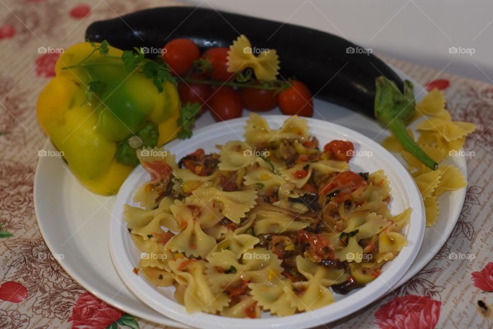 Vegetarian pasta ( Butterfly pasta, tomato, Eggplant, yellow pepper, oliva oil
