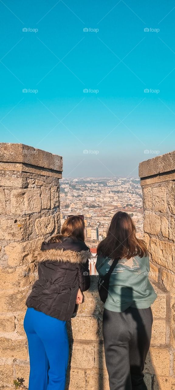 Two sisters watching over Napoli, Italy