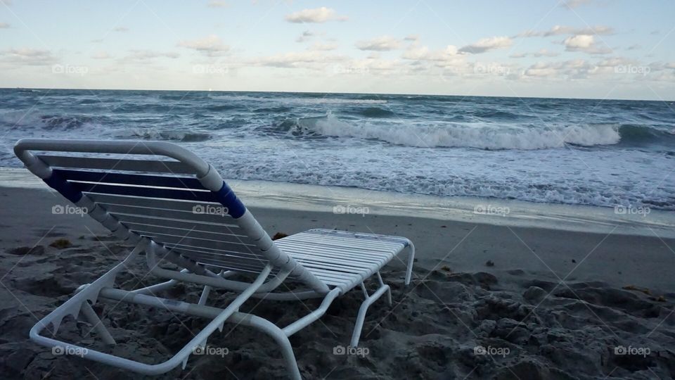 a beautiful chair in the afternoon beach.