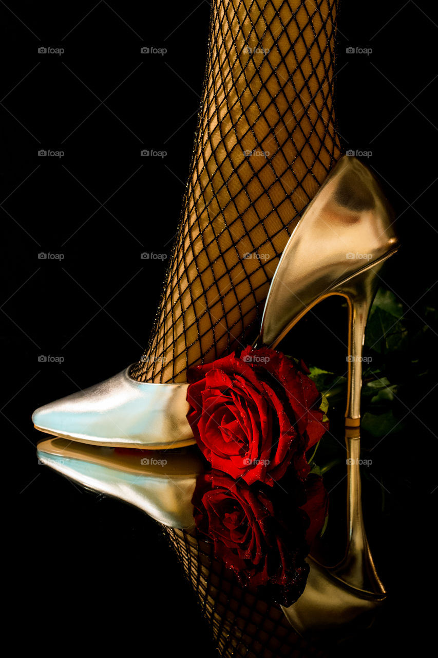 Shoe and red rose