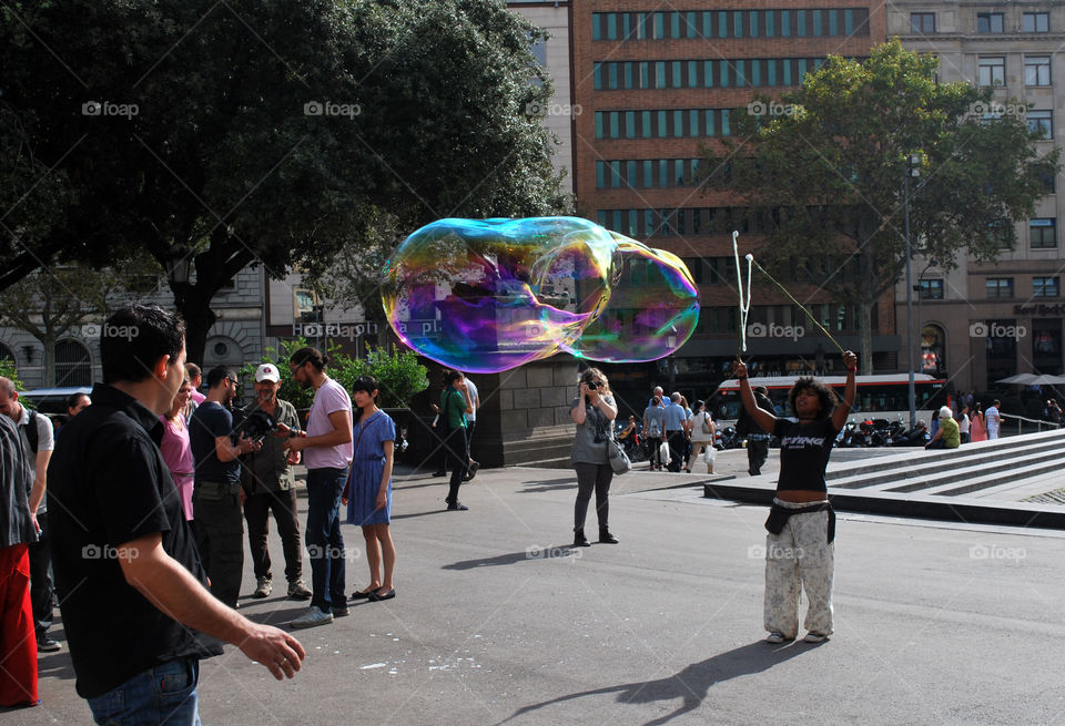 Making huge bubble on the street in Barcelona