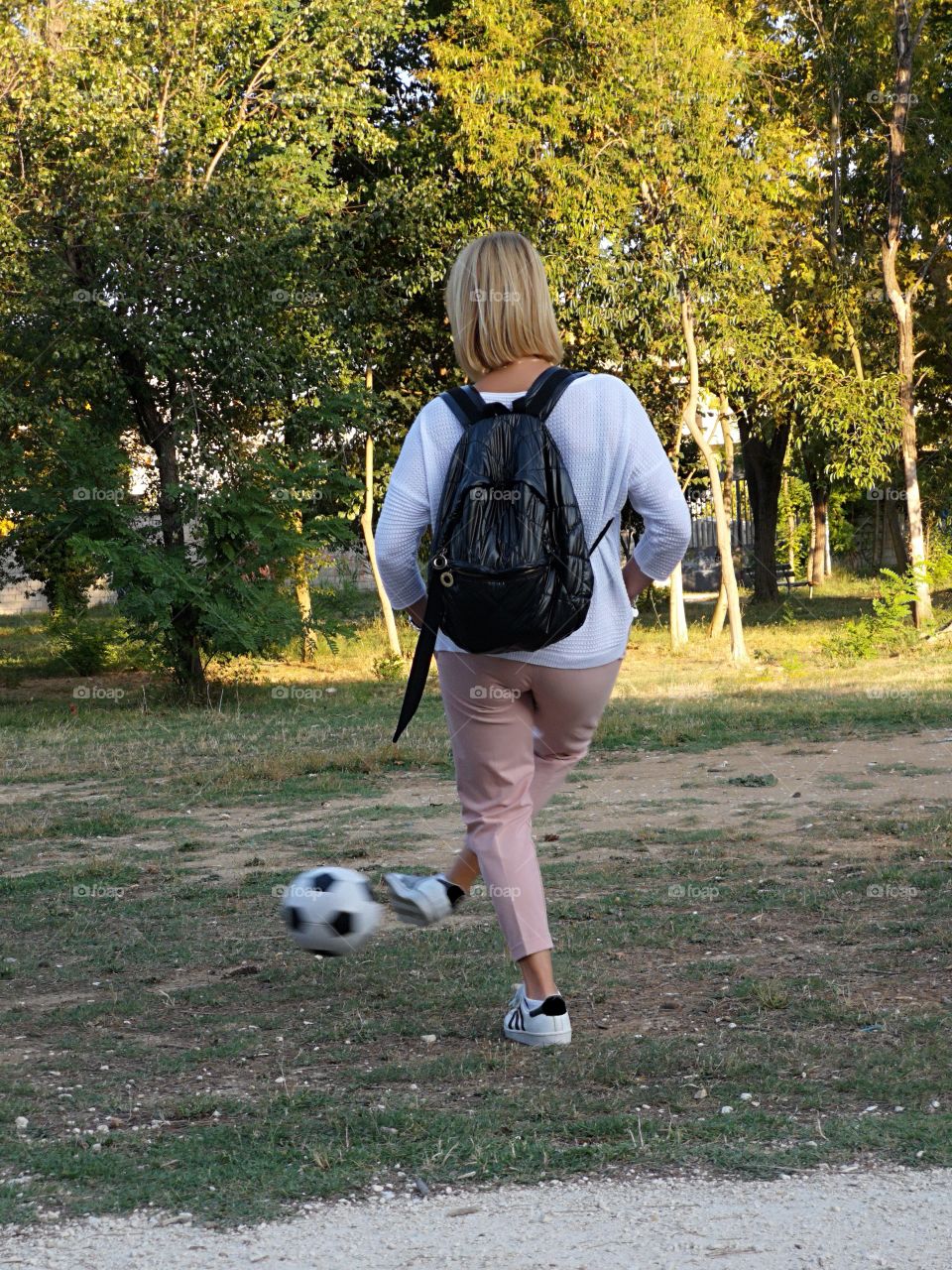 Woman kicking a ball