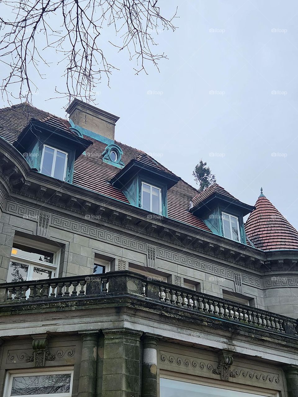 The Pittock Mansion in Oregon has interesting architectural details on every side, including balconies and rows of windows