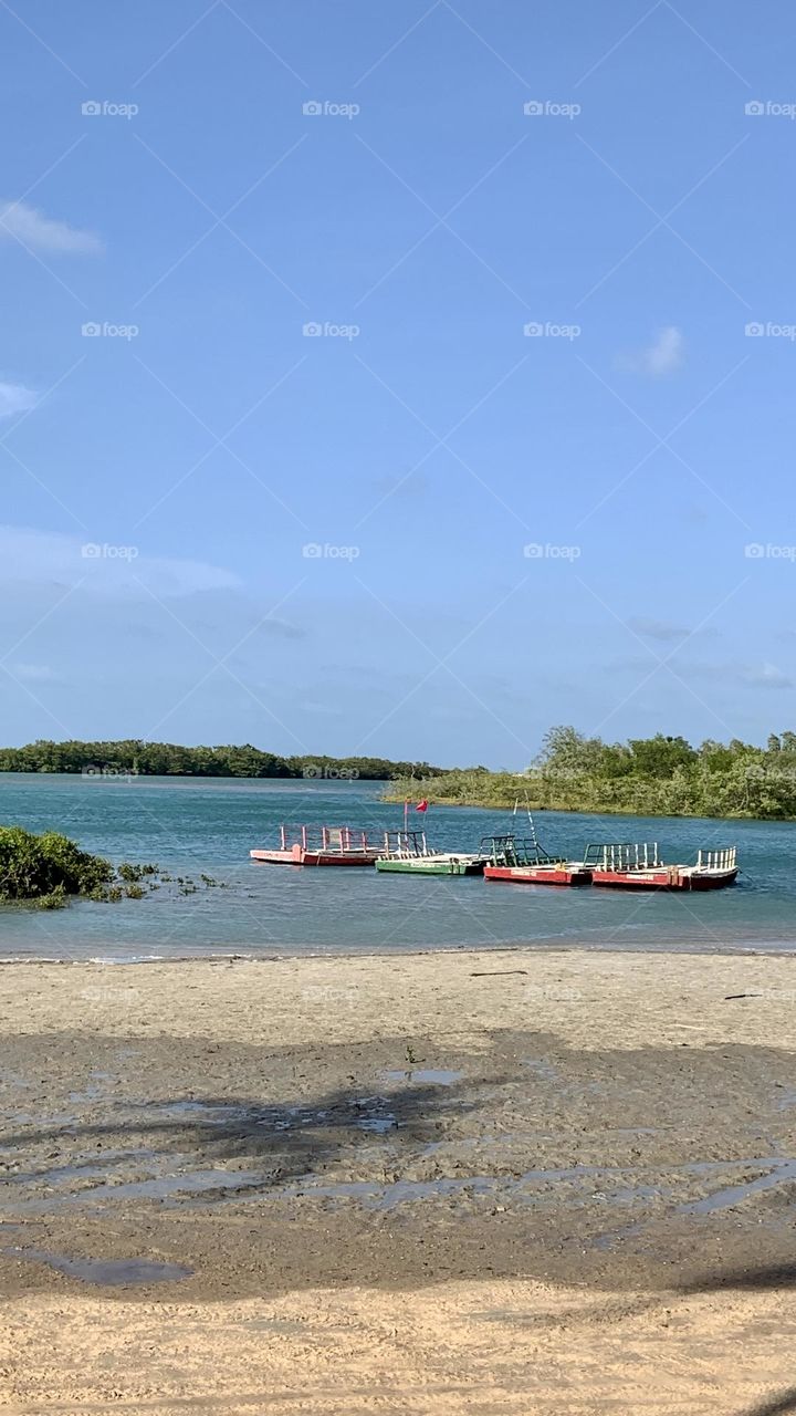 Fisherman coloured boats on river 