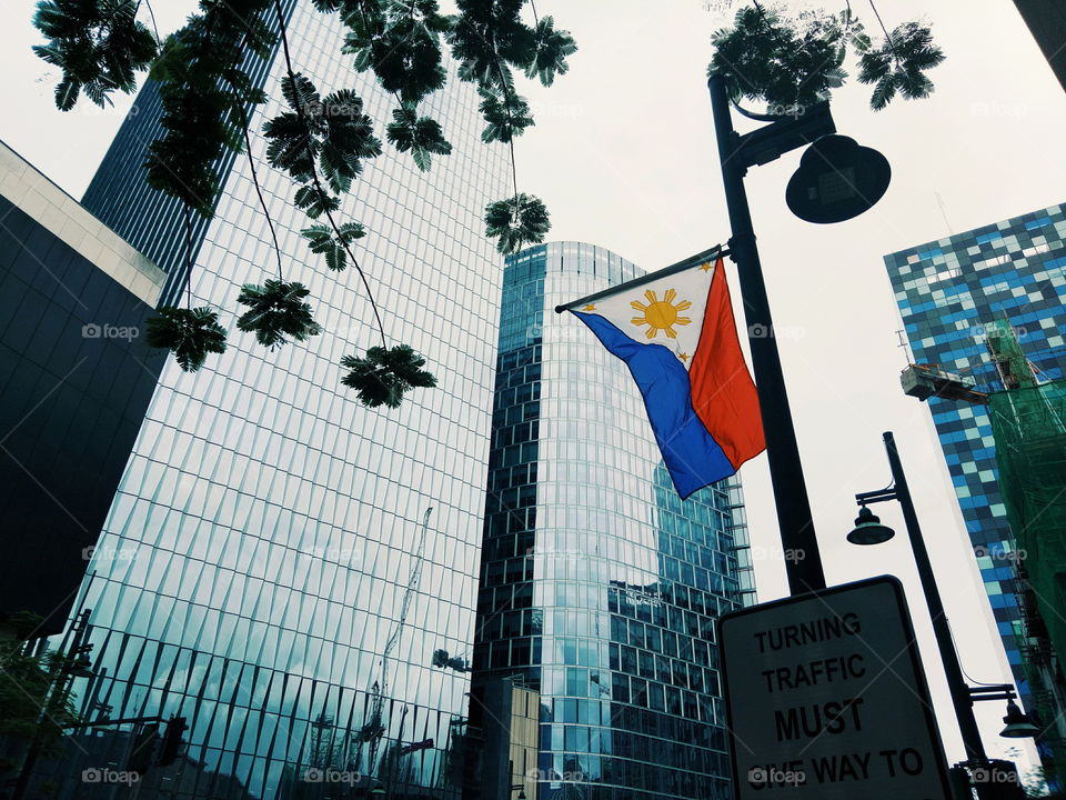Blue and Red.
Three starts and a sun! 
Pride...
Freedom marks this day.
Long live Philippines!