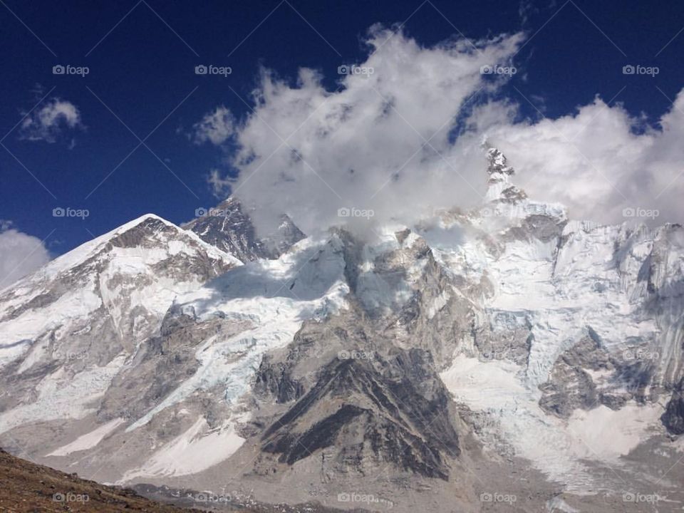 As late afternoon approached, the Everest massif slowly became obscured by clouds. Photo taken on the Everest Base Camp Trek in Nepal.