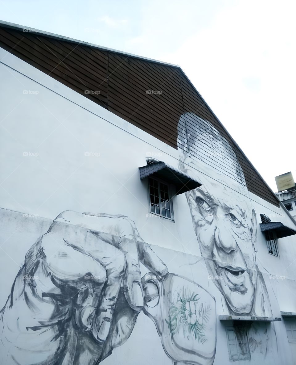 painting old man on the wall