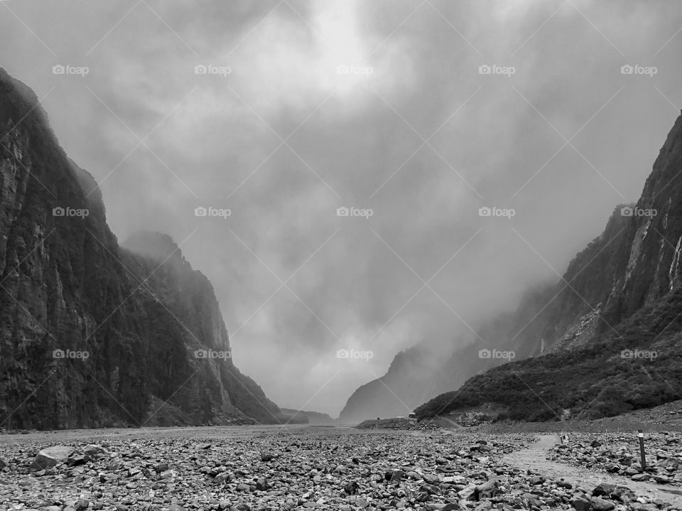 Watching the clouds roll through the Fox Glacier valley, New Zealand 