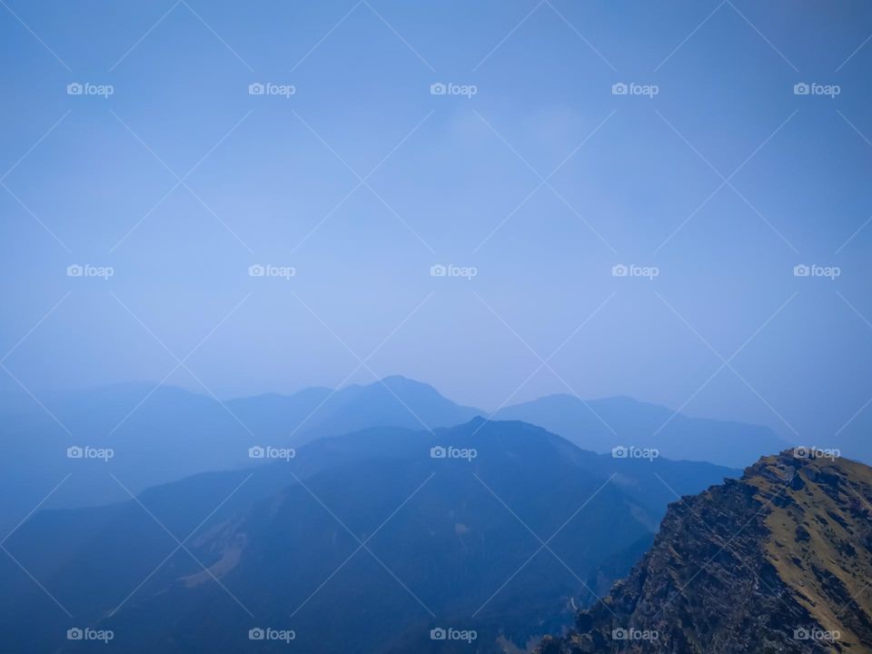 A amazing view of mountains in the fog