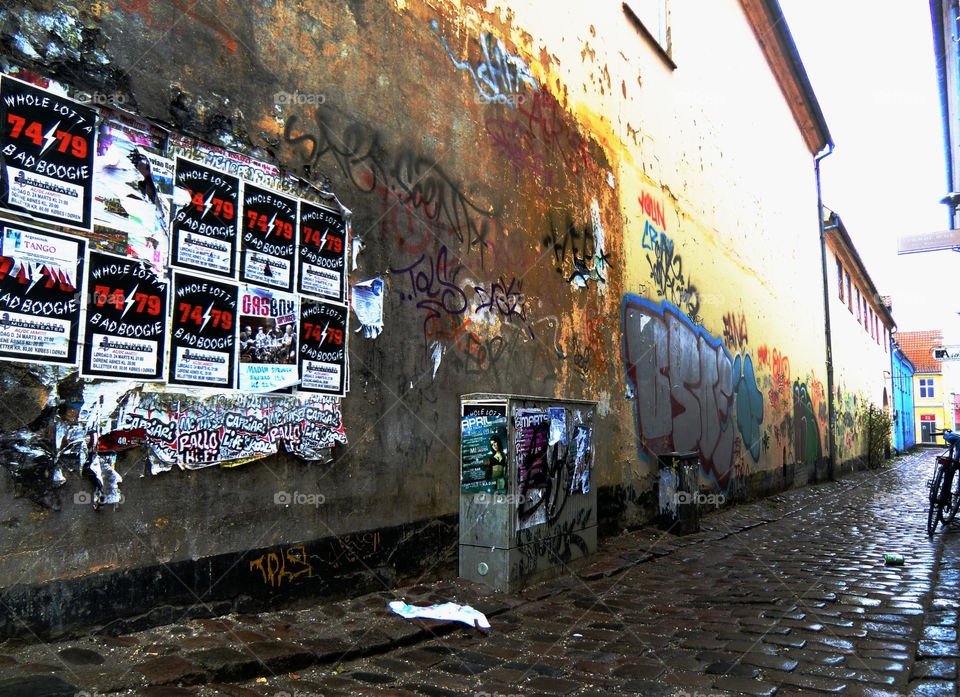 wall grafitti stones road by cabday