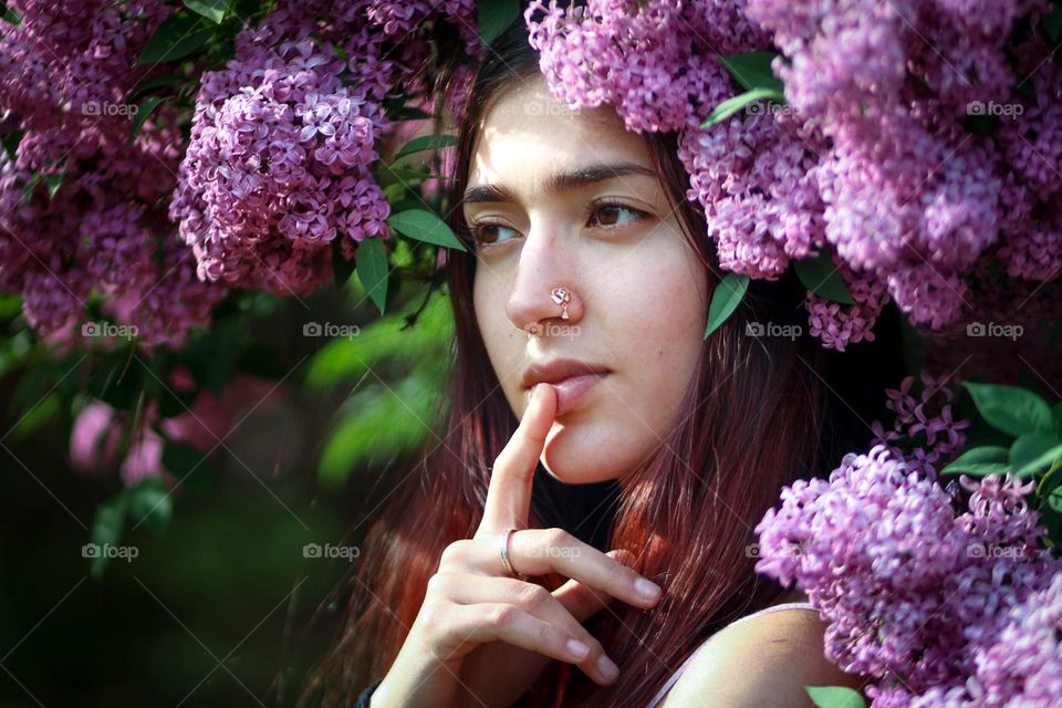 Beautiful young woman in flowers