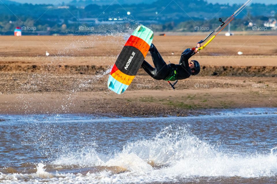 kite surfer leaps into air