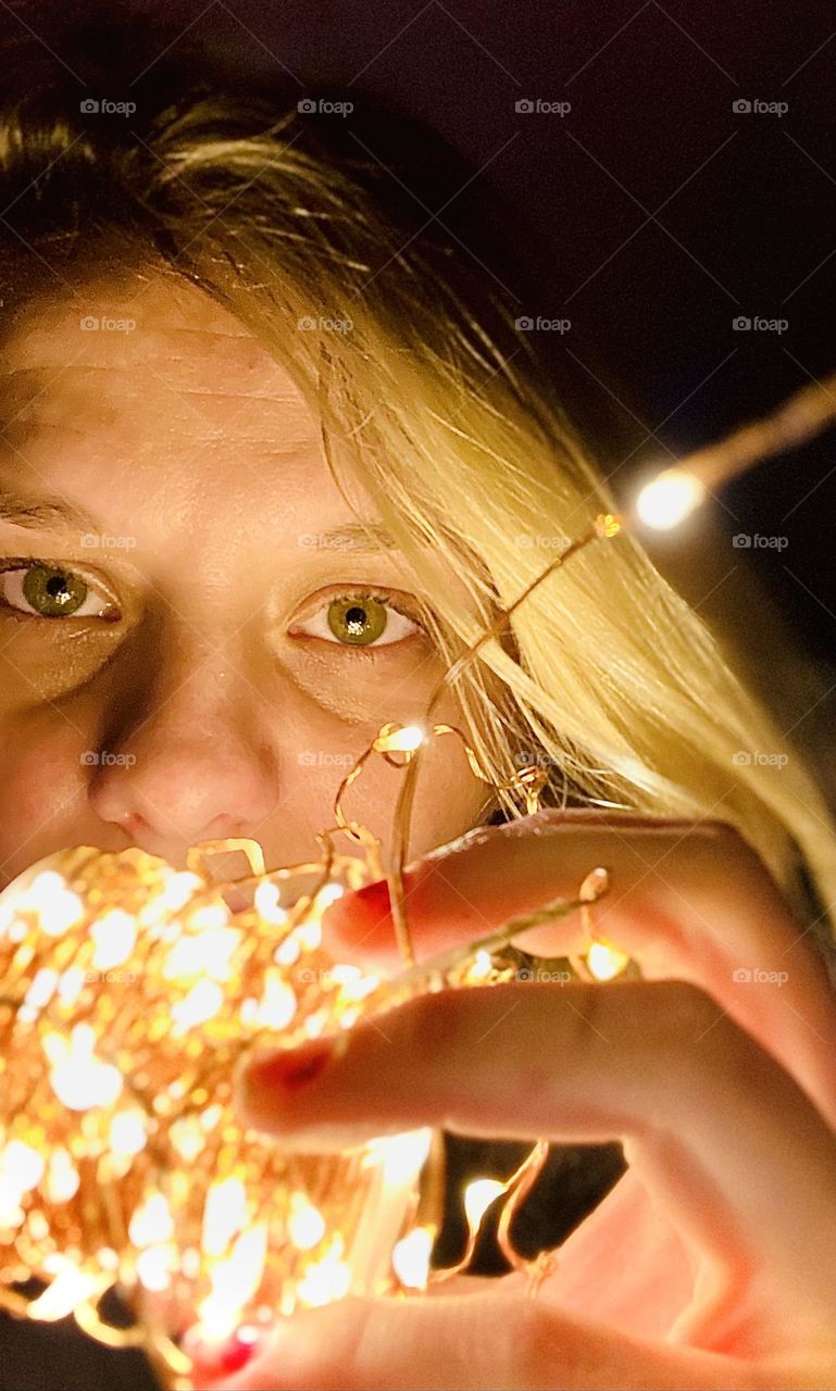 Christmas lights and green eyes 