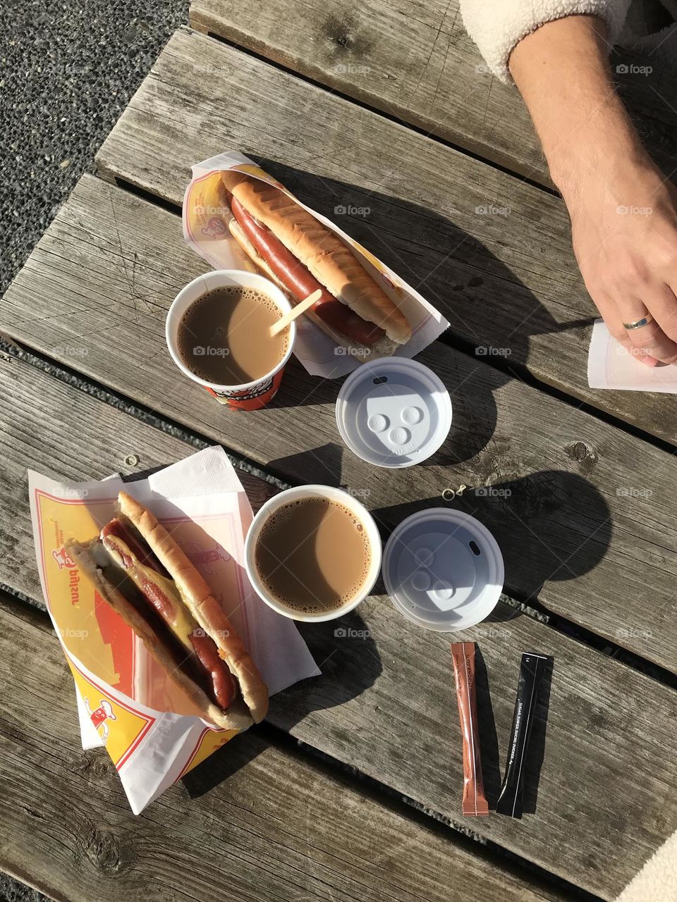 Food from above, top view of healthy food. Hot dogs and coffee. Picnic time 