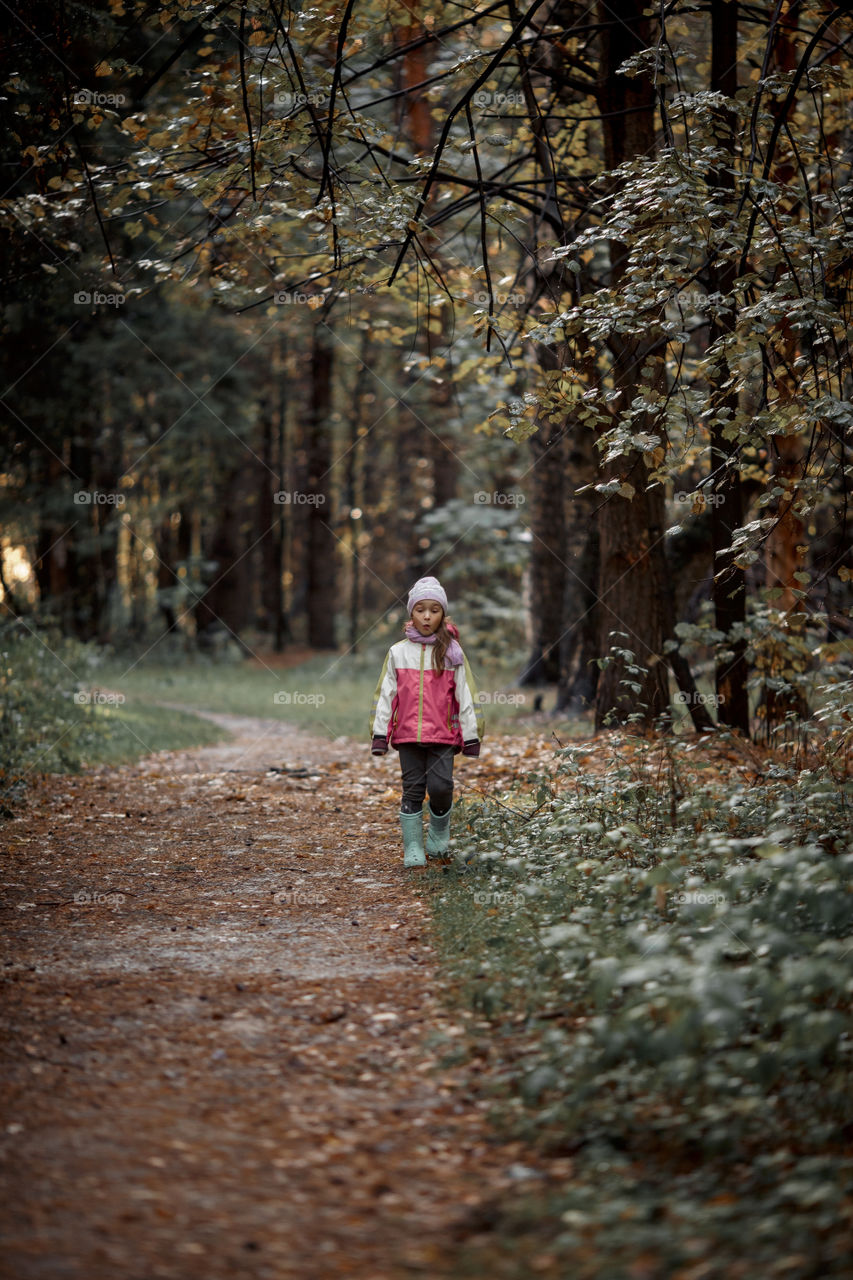 Little girl portrait in a rainy autumn day 