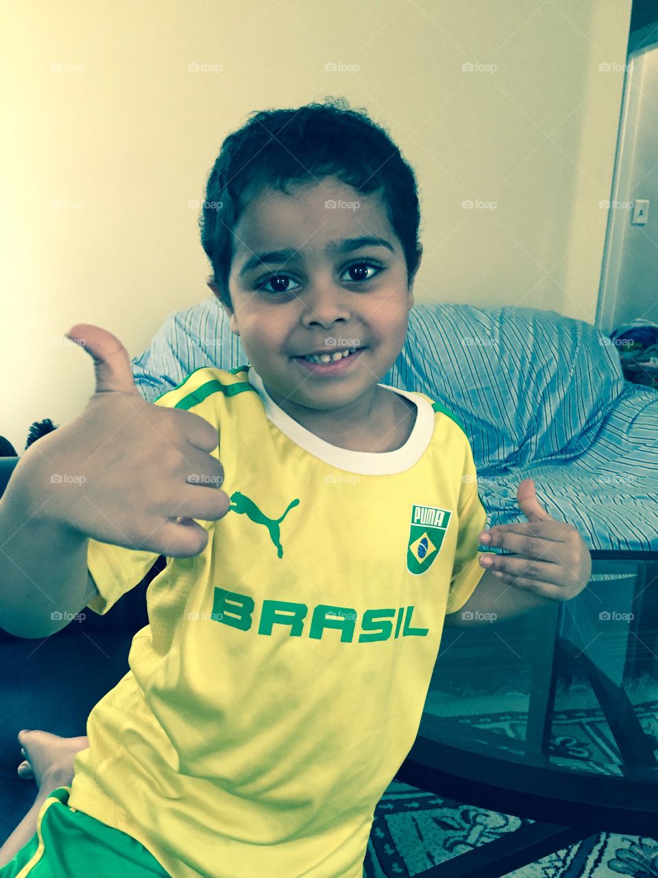 Forca Brasil!. Cute boy in yellow shirt