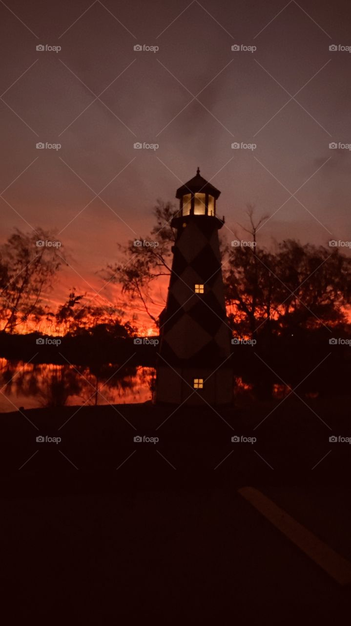 On the North Shore the Lighthouse stand lit up waiting to provide guidance for whomever travels  the dark passage. 