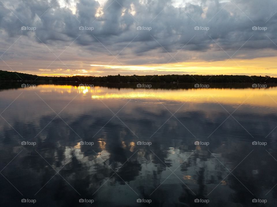 Scenic view of lake at cloudy morning