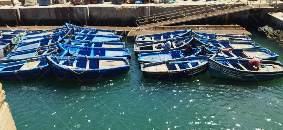 Beautiful blue boats in the harbour.