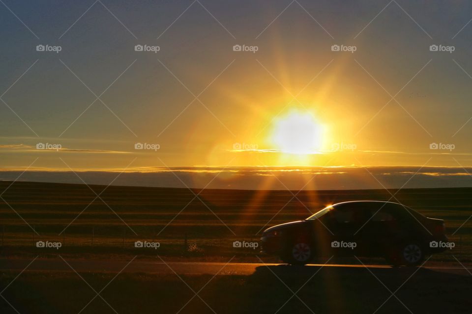 traveling in car at sunrise