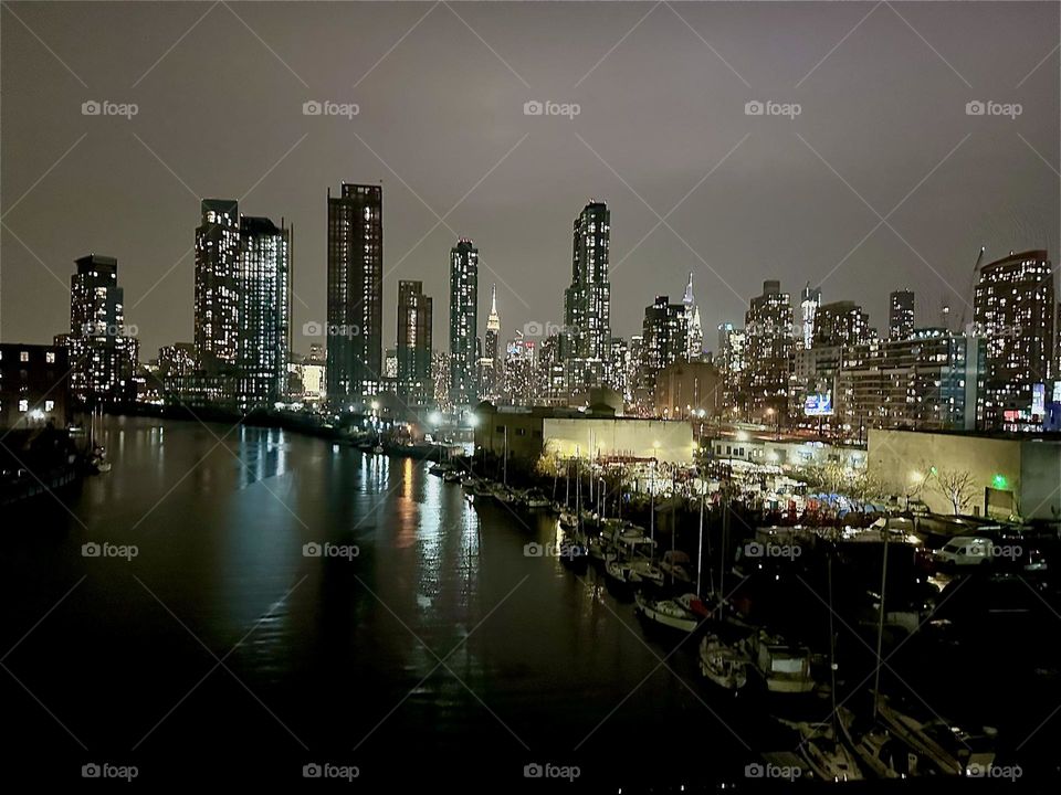 This is a breathtaking view of “Newtown Creek” from the “Pulaski Bridge” that connects “Greenpoint”, Brooklyn and LIC, Queens on an evening in early December 2023. Hypnotic Productions