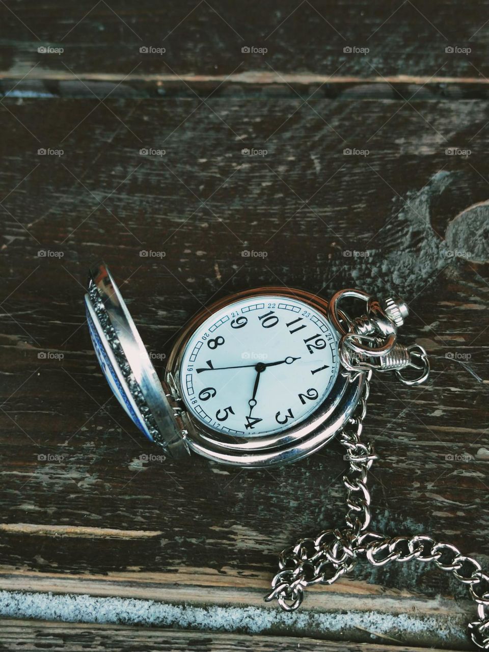 Minimalism.  Pocket watch on a metal chain