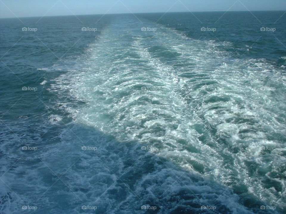 waves behind a boat
