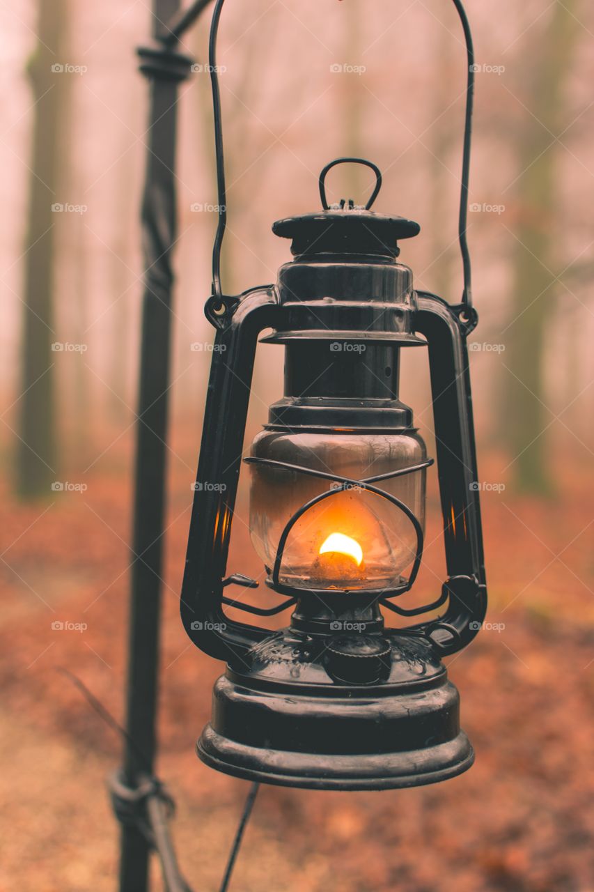 Kerosene lamp burning in forest