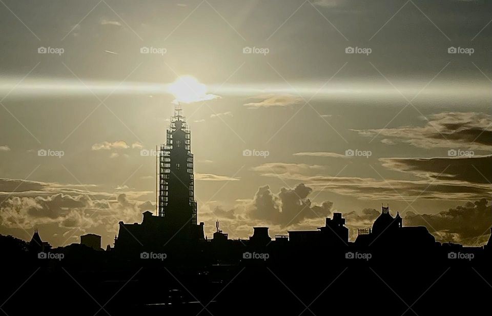 Sun on top of a church making it look like a Lighthouse