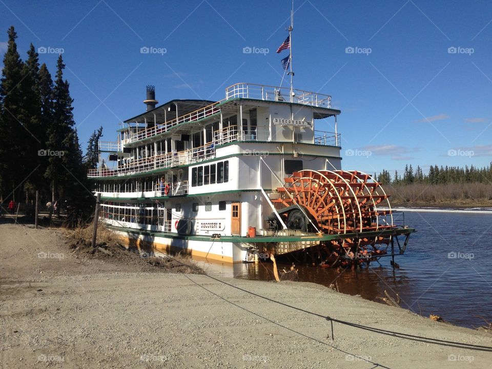 The Discovery Paddle Wheel Boat captured docking along the Chena River in ALASKA. 